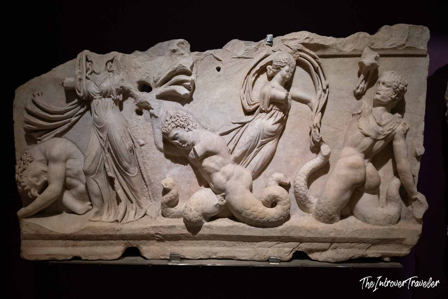 Ancient Roman marble sarcophagus relief with mythological figures and serpents, Istanbul Archaeological Museum
