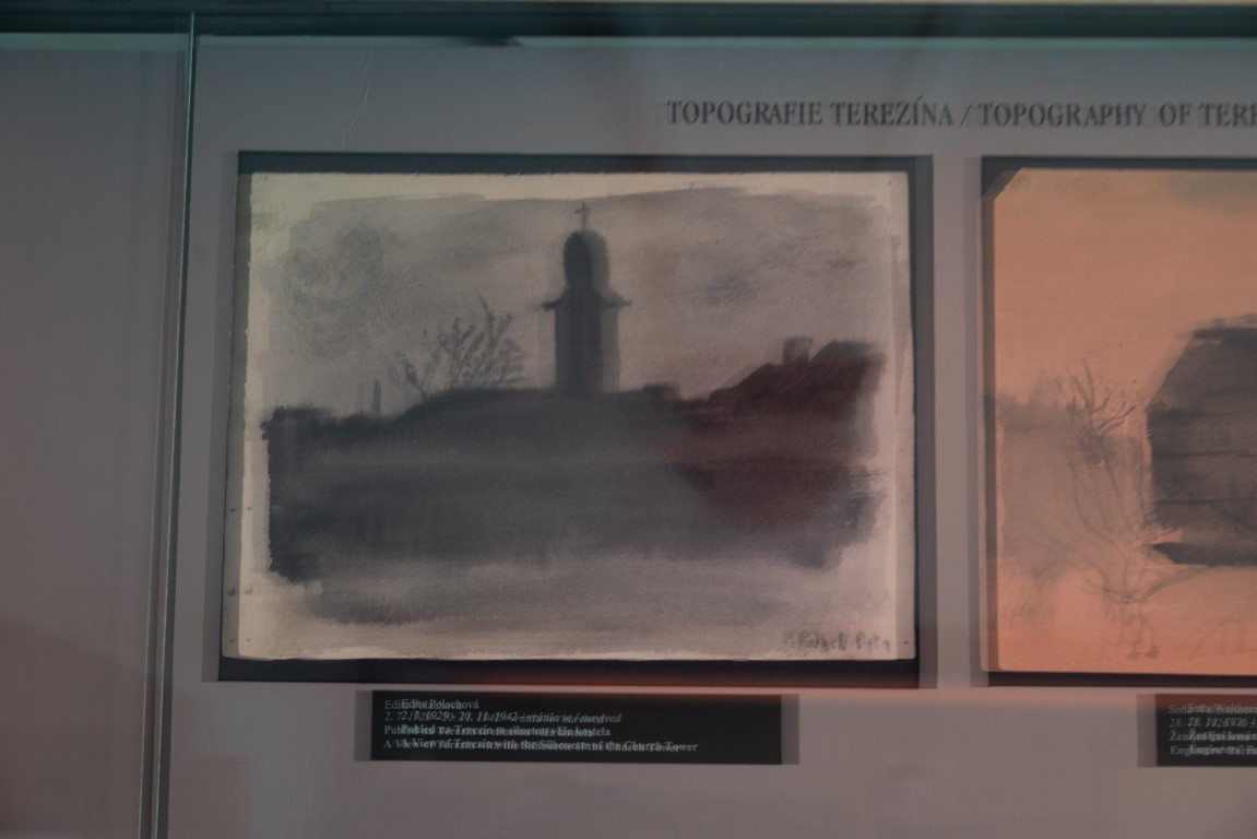 Charcoal drawing of Terezin with church tower by Edita Polachova, displayed at Terezin Memorial exhibition