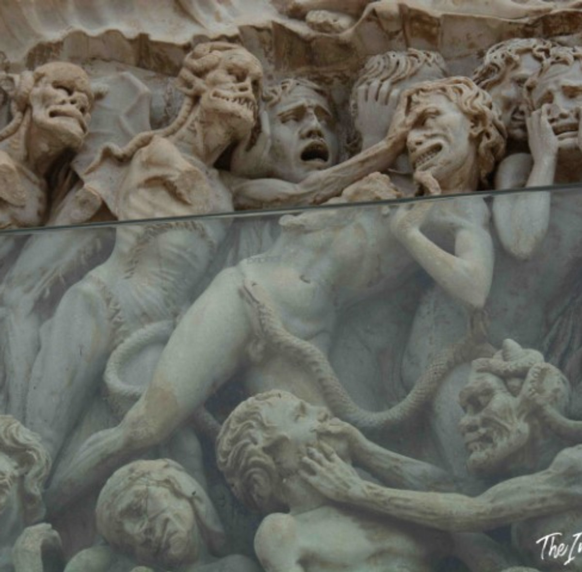 Close-up of tortured figures in Luca Signorelli's Last Judgment relief, Orvieto Cathedral