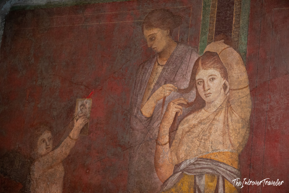 Ancient Roman fresco in the Villa of the Mysteries, Pompeii, showing women in a ritual scene