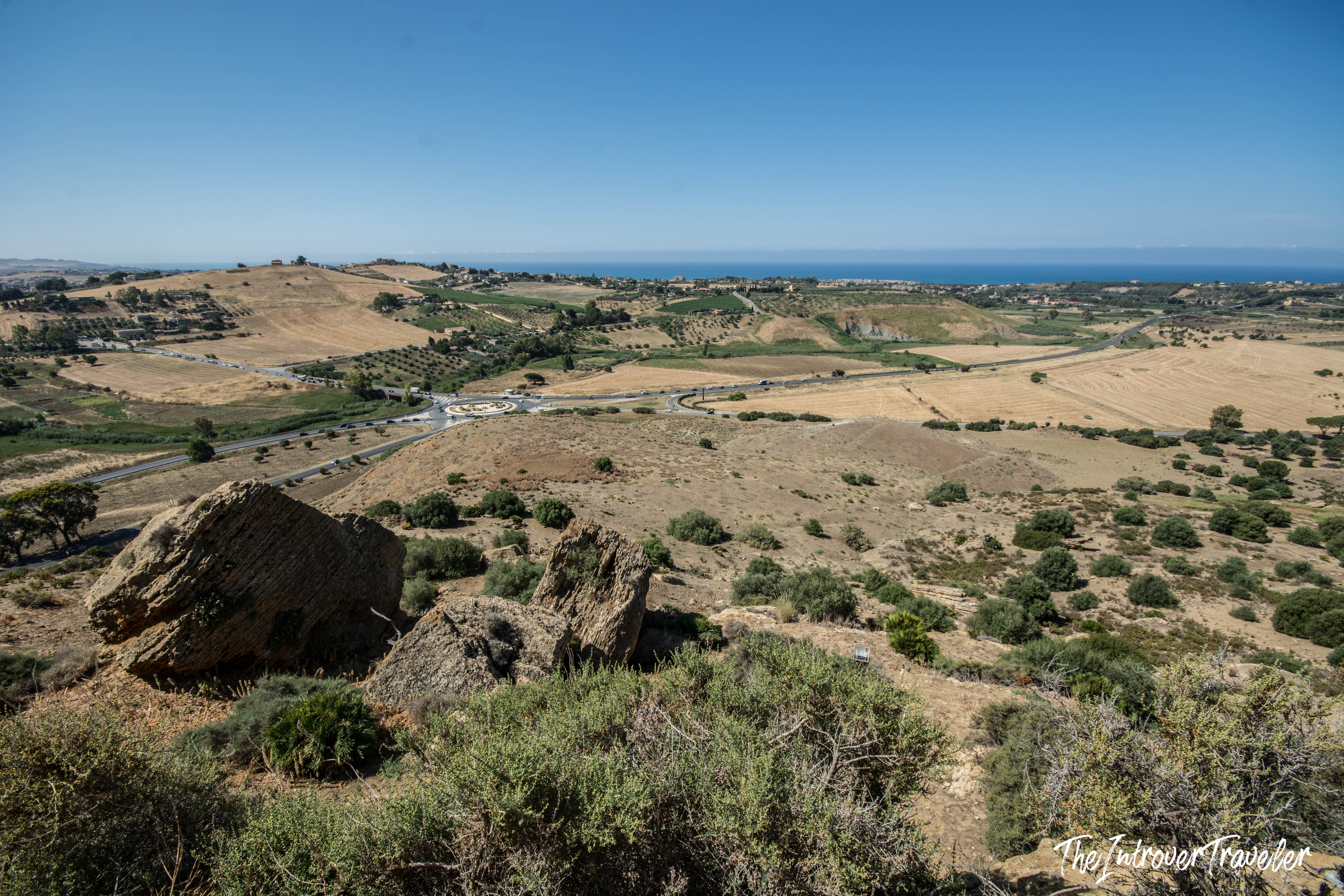 Panoramic view from the Valley of the Temples acropolis, Agrigento, overlooking Sicilian countryside and Mediterranean Sea
