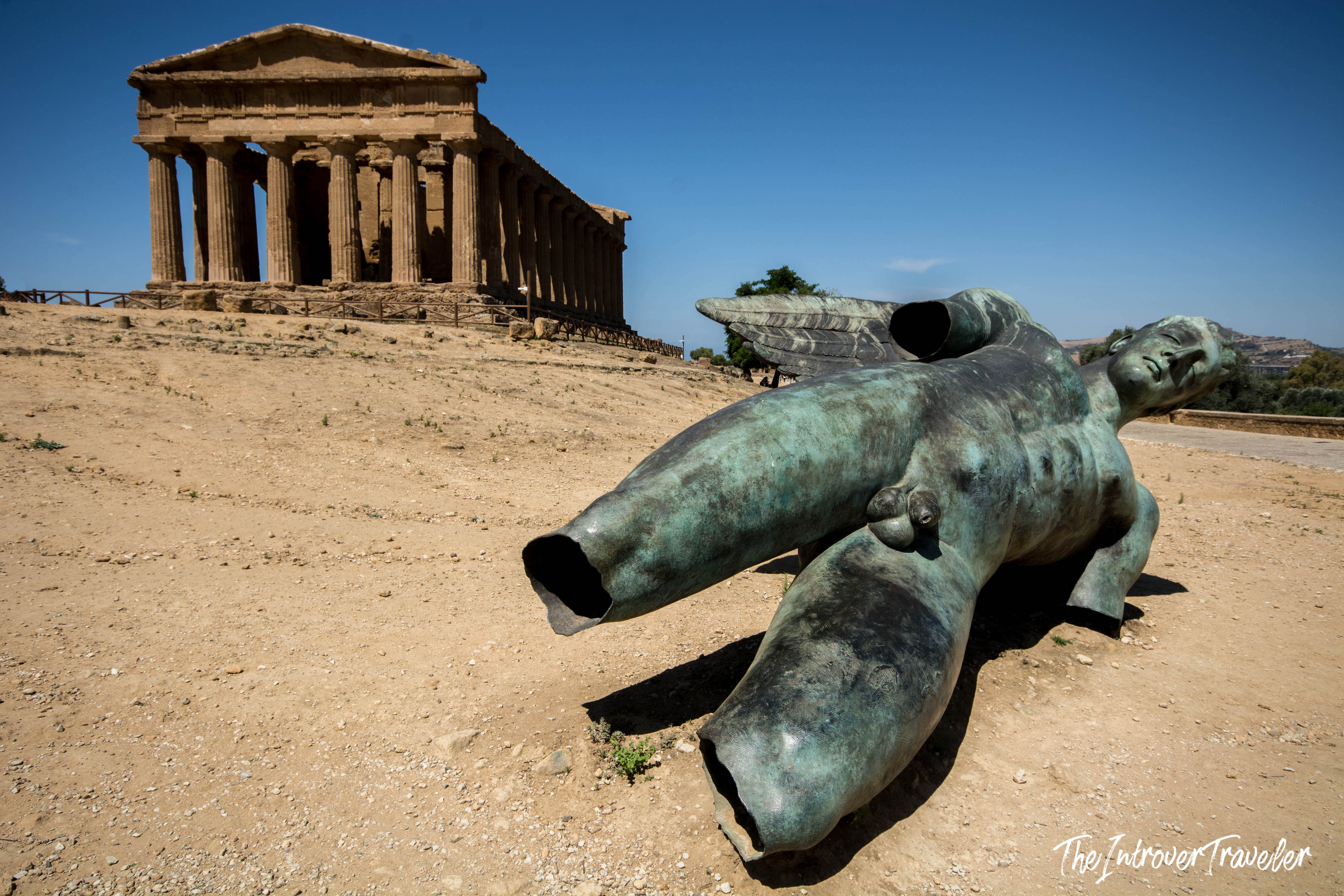 Fallen Icarus bronze sculpture by Igor Mitoraj before the Temple of Concordia, Valley of the Temples, Agrigento