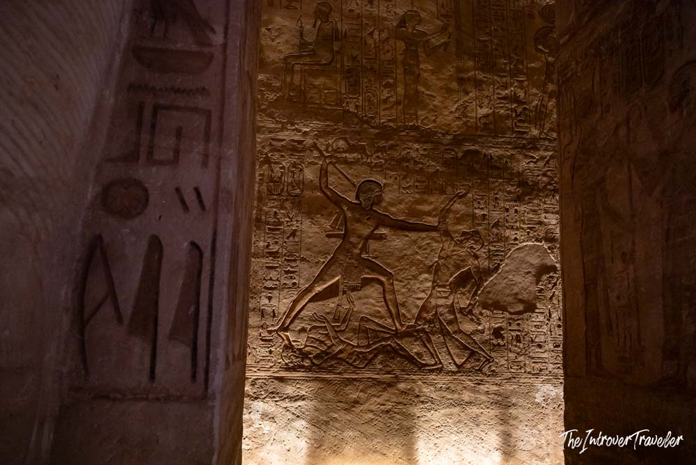 Battle scene relief of Ramesses II at Abu Simbel, carved walls with hieroglyphics inside the temple