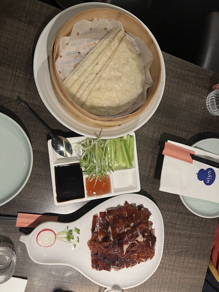 Peking duck with thin pancakes, hoisin sauce, and cucumber at Uluh restaurant in New York