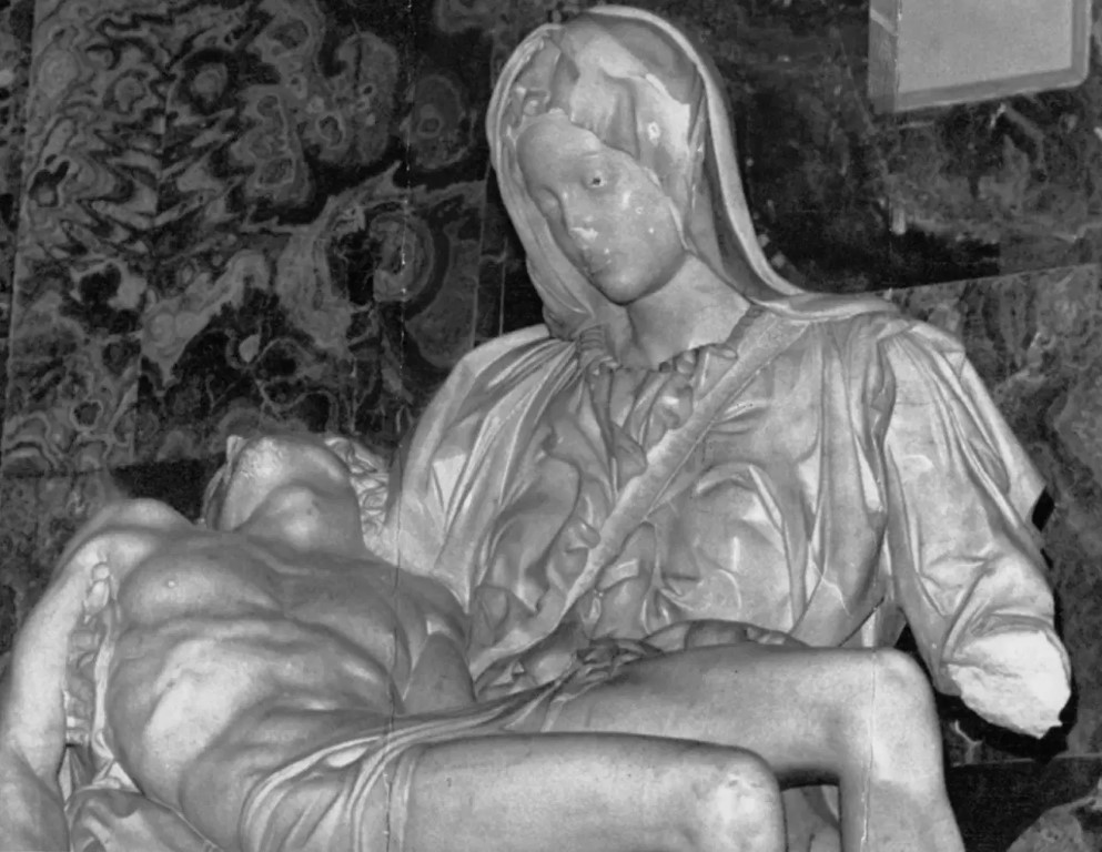 Black and white close-up of Michelangelo's Pieta, Vatican, showing Mary cradling Christ after the 1972 attack