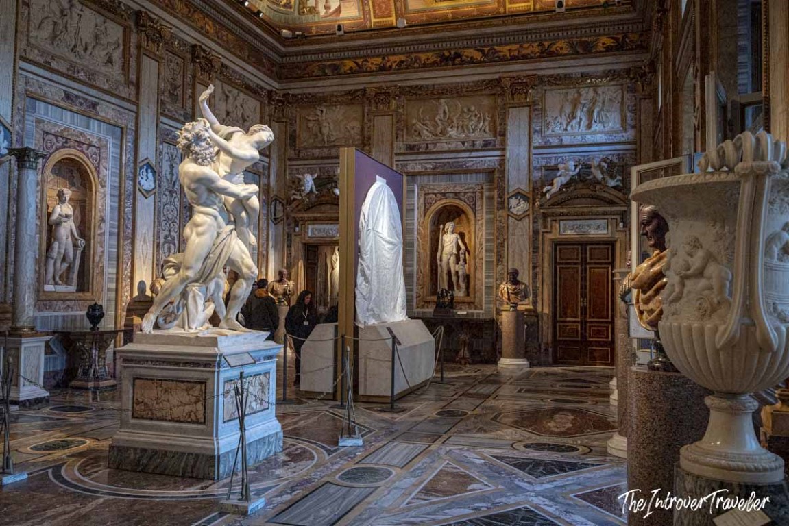 Bernini's Rape of Proserpina in the ornate Sala IV of the Borghese Gallery, Rome