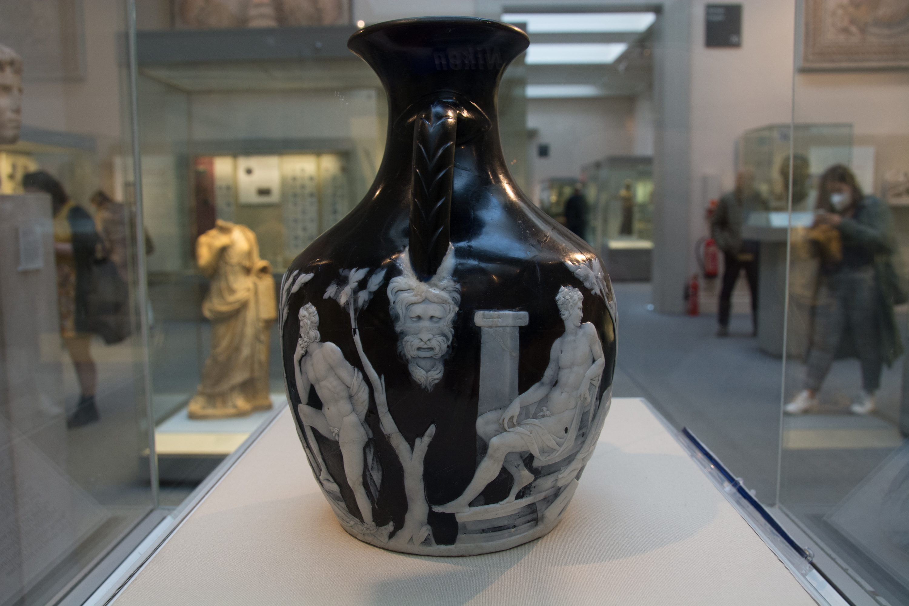 Portland Vase on display at the British Museum, a Roman cameo glass masterpiece with white mythological figures