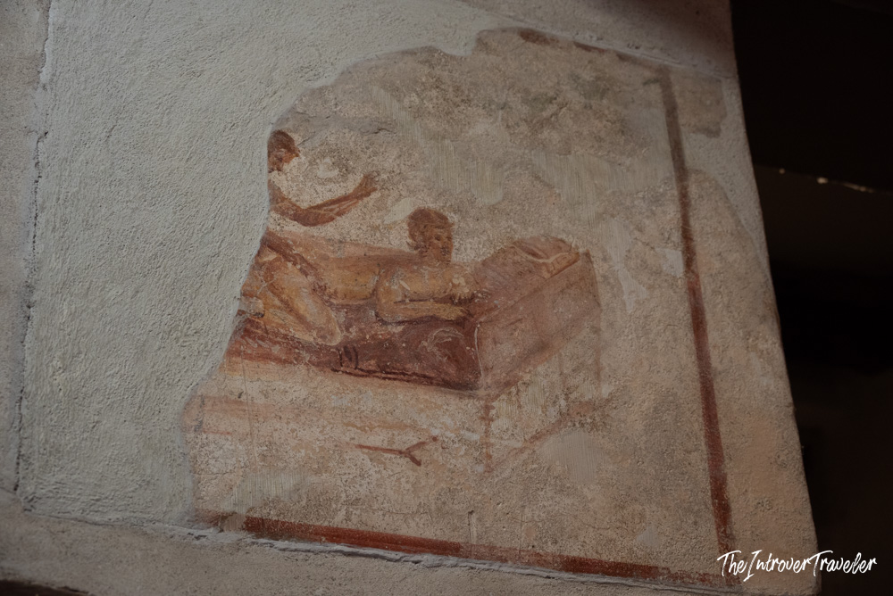 Erotic fresco on the wall of the Lupanar brothel in ancient Pompeii