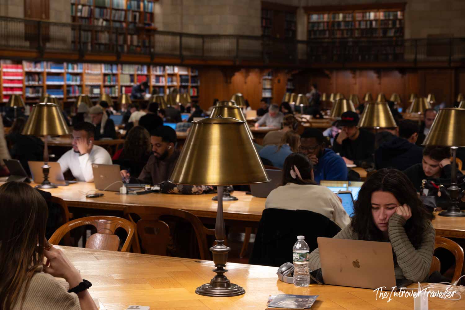 Rose Main Reading Room at the New York Public Library, filled with visitors studying under brass lamps