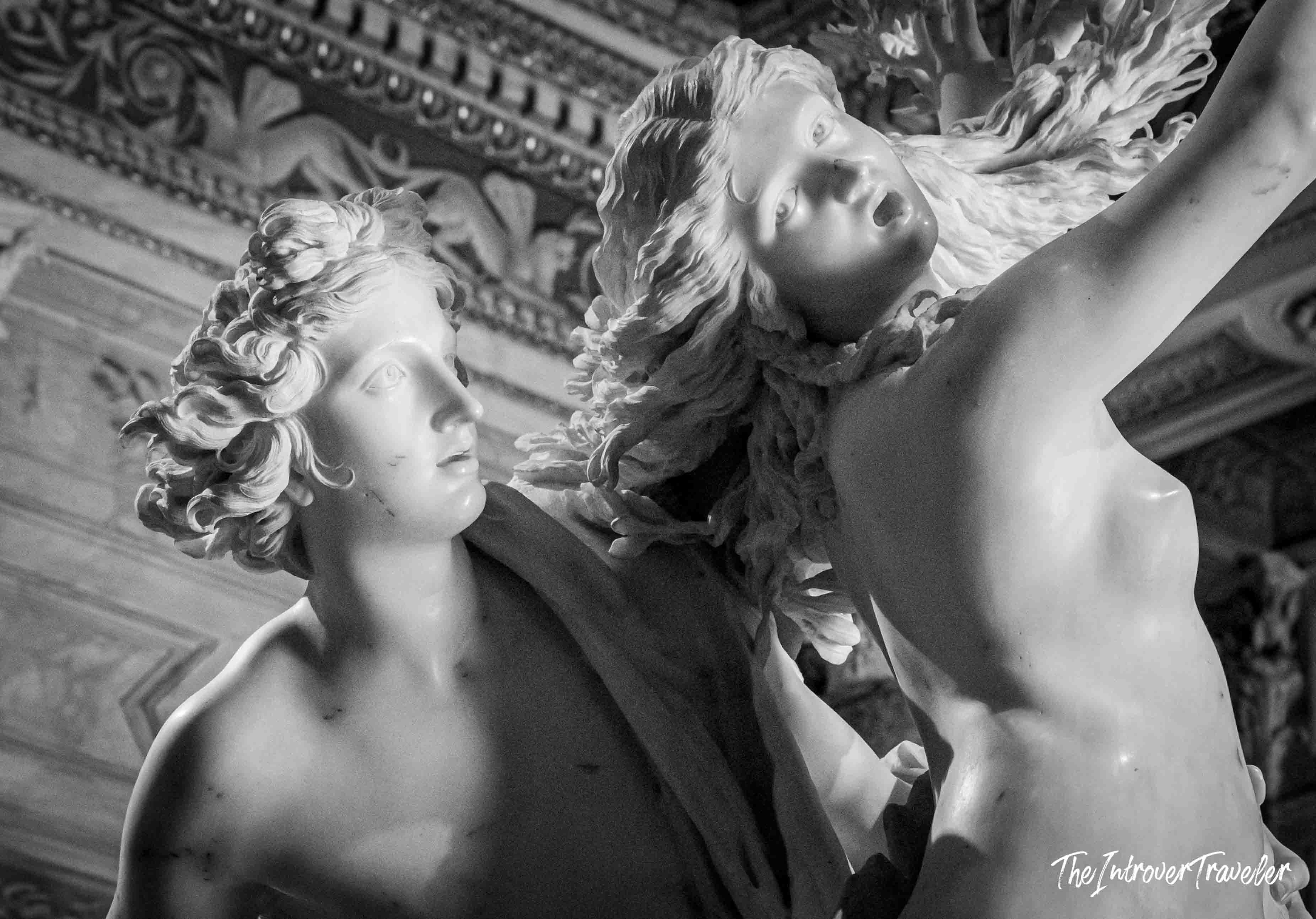 Close-up of Apollo and Daphne by Bernini, showing expressive faces and flowing marble hair at Borghese Gallery Rome