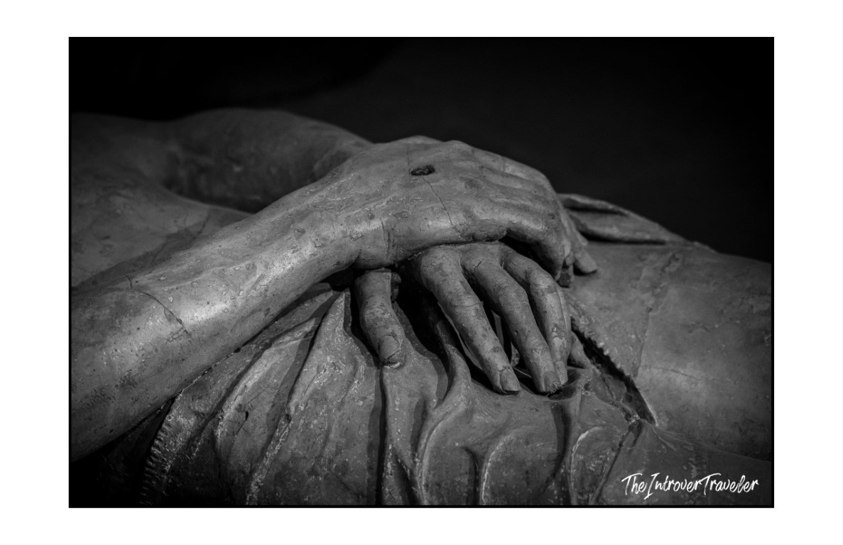 Close-up of Christ's folded hands with stigmata wound, Lamentation over the Dead Christ by Niccolò dell'Arca