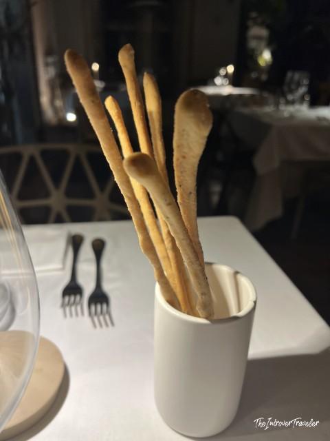 Grissini breadsticks served in a white cup at L'Ebbrezza di Teonilla, Naples