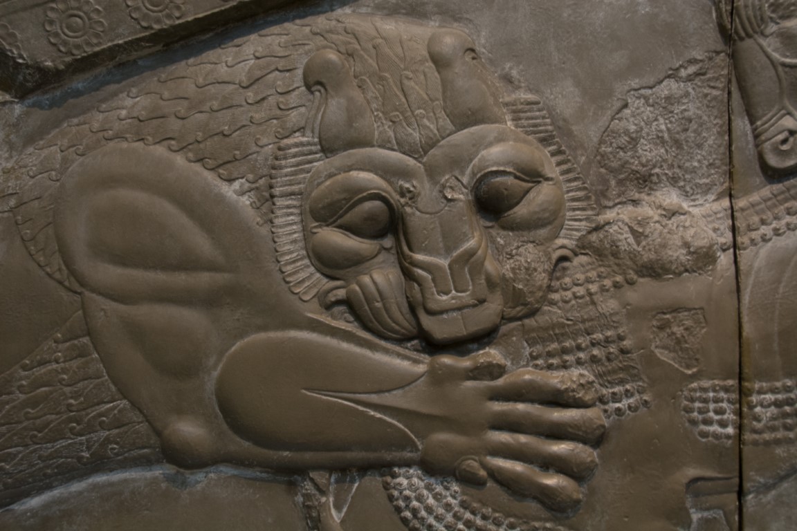Close-up of an ancient Assyrian lion hunt relief at the British Museum, London