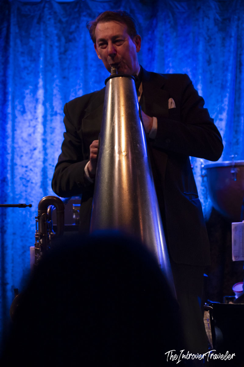 Vince Giordano playing a giant metal horn at Birdland jazz club, New York