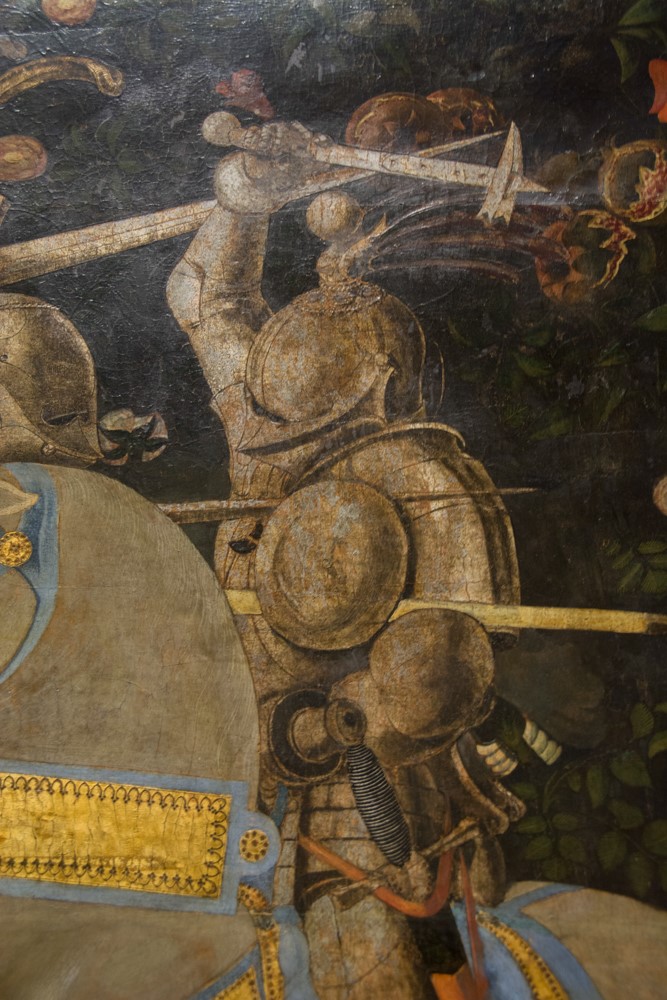 Close-up detail of armored knights in battle, from a Renaissance painting at the National Gallery London