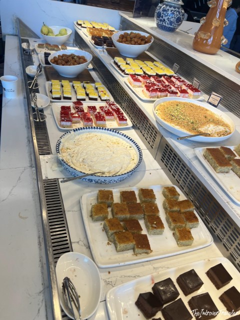 Turkish dessert buffet at IGA Lounge Istanbul Airport, featuring baklava, kazandibi, and assorted sweets