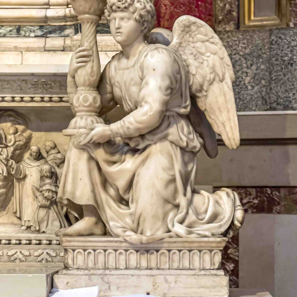 Marble angel holding a candelabra by Michelangelo on the Ark of Saint Dominic, Bologna