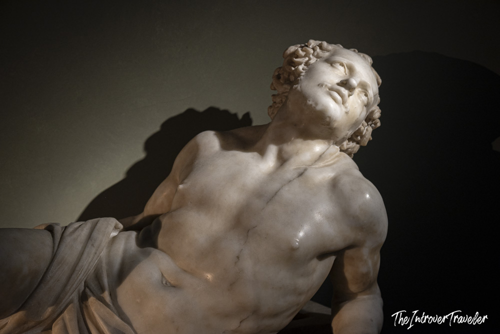 Close-up of Bernini's Saint Lawrence marble sculpture, head tilted back in agony, Uffizi Gallery Florence