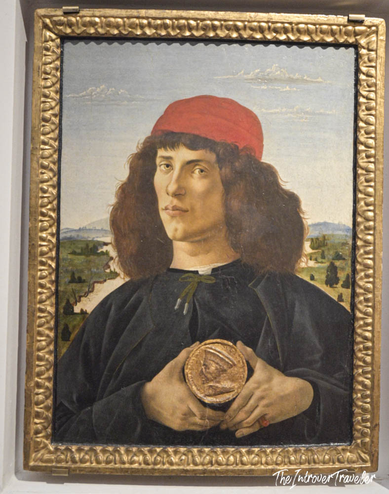 Botticelli's Portrait of a Young Man with a Medal, on display at the Uffizi Gallery Florence