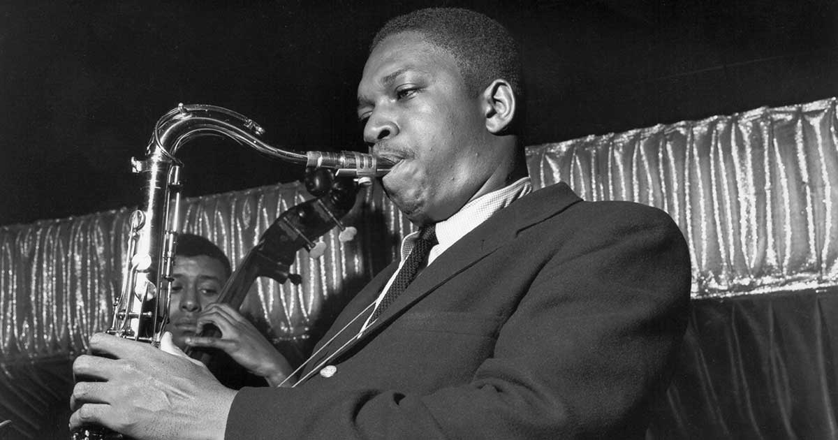 Black and white vintage photo of a jazz saxophonist performing live, evoking Birdland's storied New York jazz history