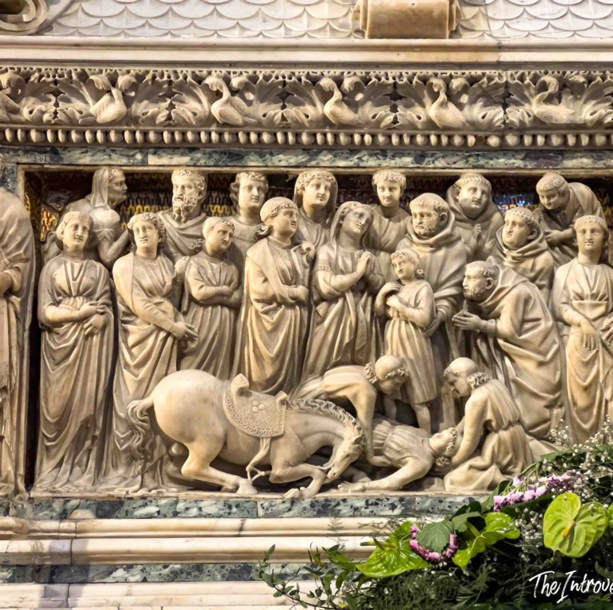 Detailed marble relief panel on the Ark of Saint Dominic, Bologna, showing robed figures and a horse