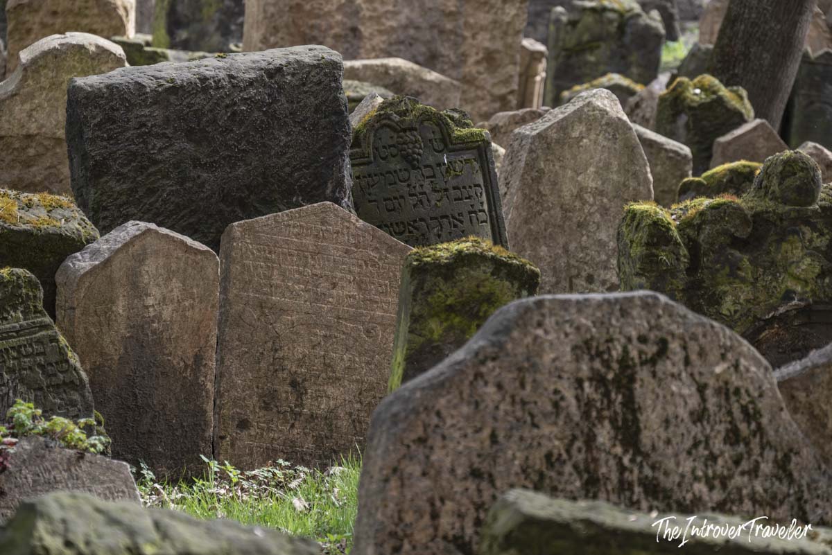 Densely packed ancient headstones with Hebrew inscriptions at the Old Jewish Cemetery in Prague