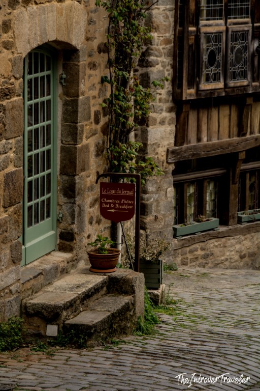 Le Logis du Jerzual bed and breakfast sign on a cobblestone street in medieval Dinan, France