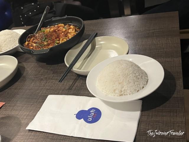 Steamed white rice and mapo tofu served at Uluh Chinese restaurant in New York