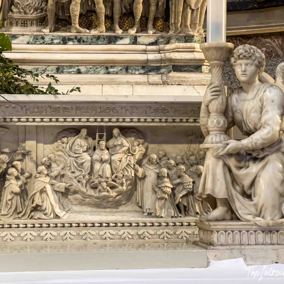 Marble relief panel and angel candelabra figure on the Ark of Saint Dominic, Bologna