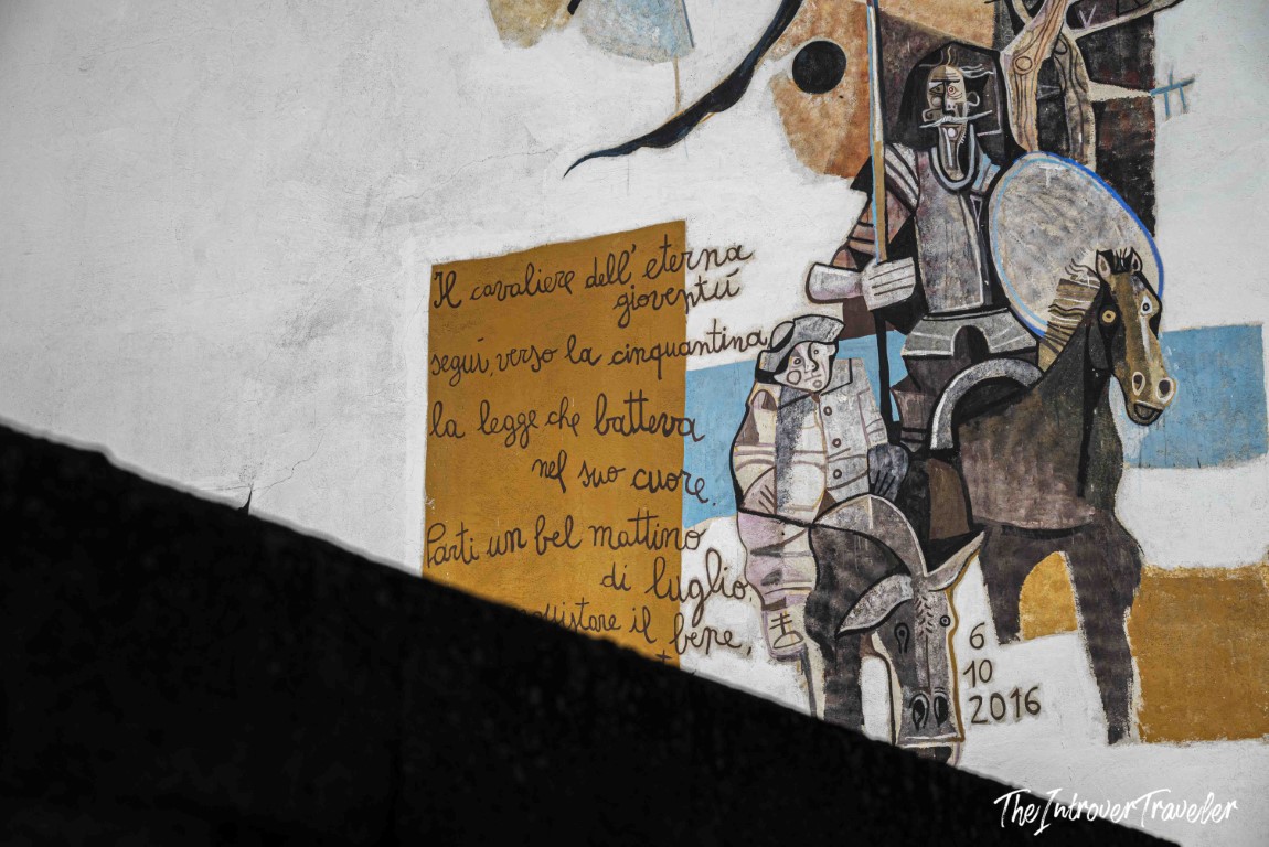 Orgosolo mural of an armored knight on horseback with Italian verse, dated October 6 2016