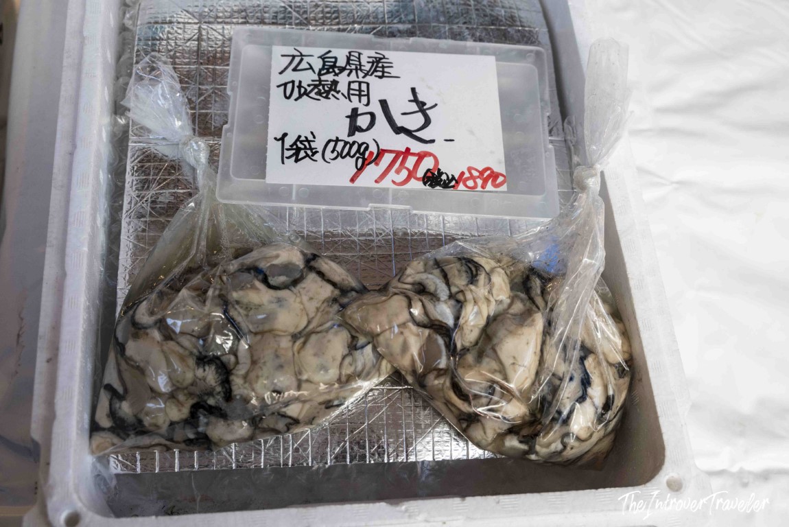 Fresh Hiroshima oysters (kaki) sold by the bag at Tsukiji fish market, Tokyo