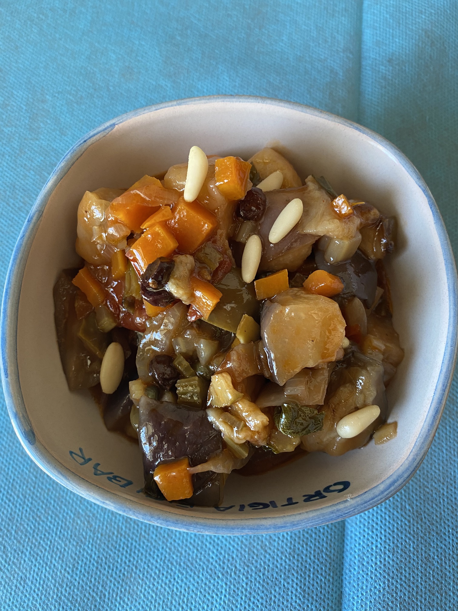Sicilian caponata with pine nuts, raisins, and vegetables served at Ortigia Bar, Syracuse