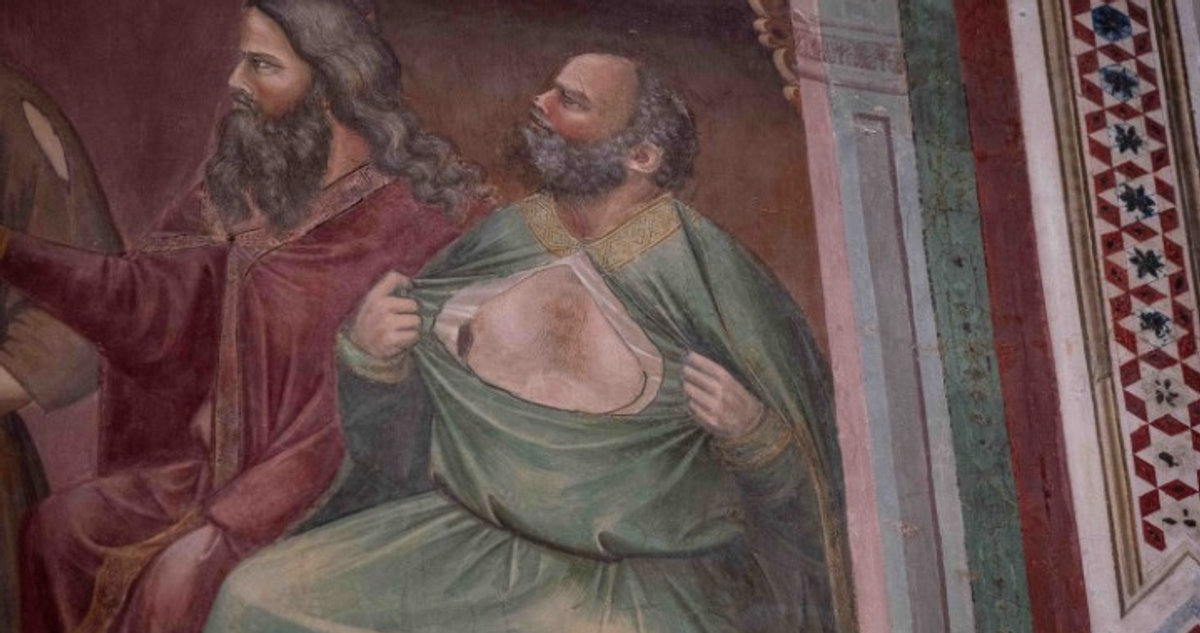 Detail of a Giotto fresco in the Scrovegni Chapel, Padua, showing a bearded figure tearing his robe
