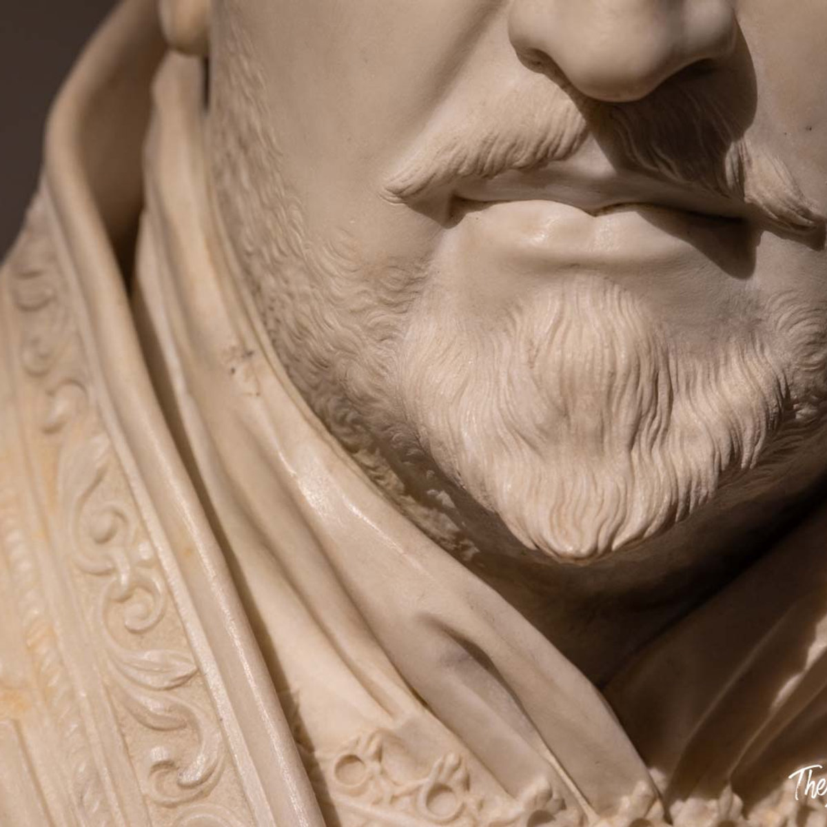 Close-up of a Bernini marble bust showing finely carved beard and ornate collar detail, Palazzo Barberini exhibition