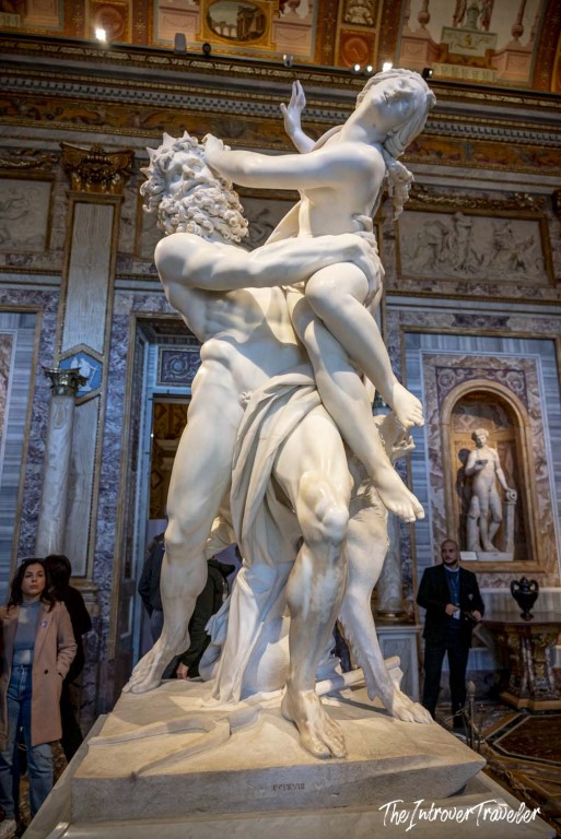 Bernini's Rape of Proserpina marble sculpture at Galleria Borghese, Rome, showing Pluto lifting Proserpina