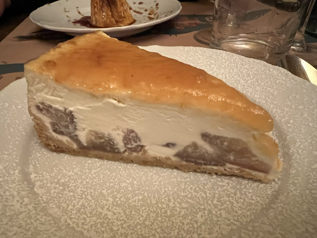 Slice of ricotta tart with fruit filling, a classic dessert at Trattoria Cibrèo in Florence