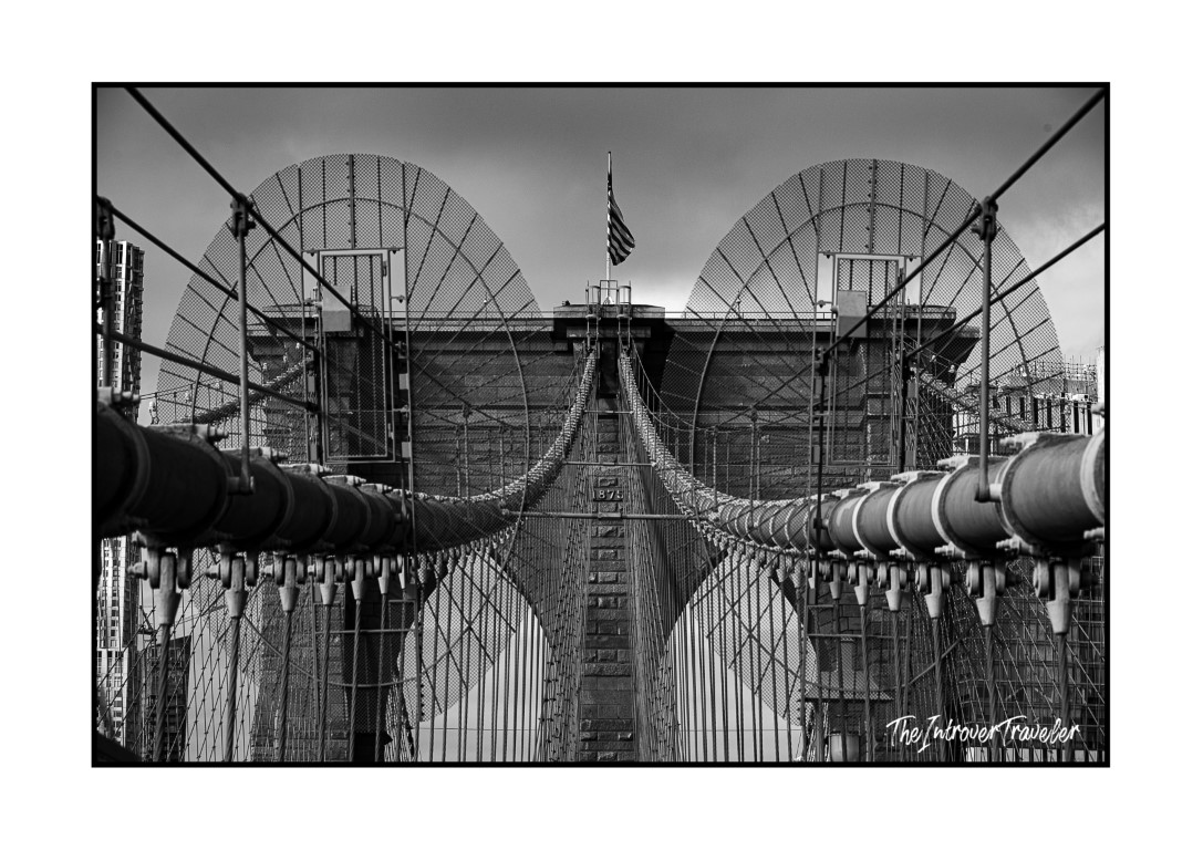 Black and white close-up of Brooklyn Bridge cables and tower, New York street photography December 2024