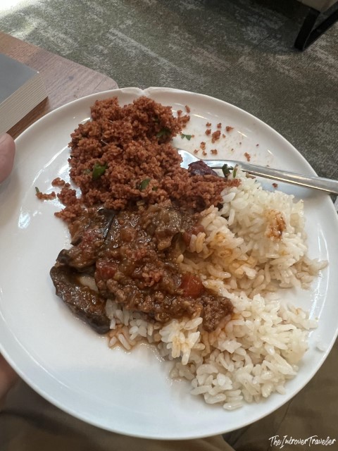 Turkish buffet plate with rice, kısır, and braised meat at IGA Lounge, Istanbul Airport