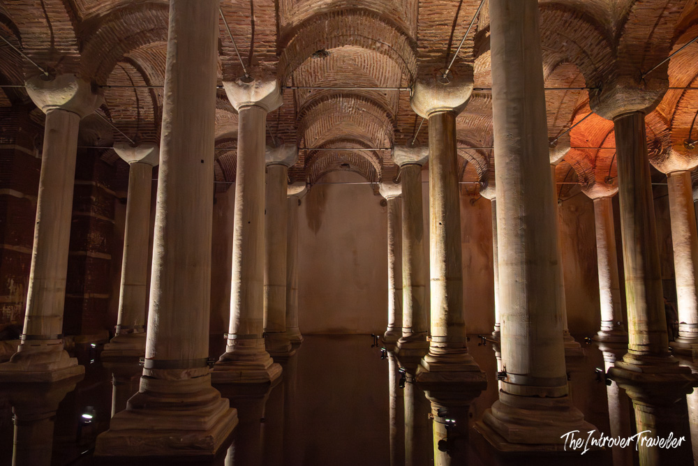 Rows of ancient marble columns reflected in water inside the Basilica Cistern, Istanbul