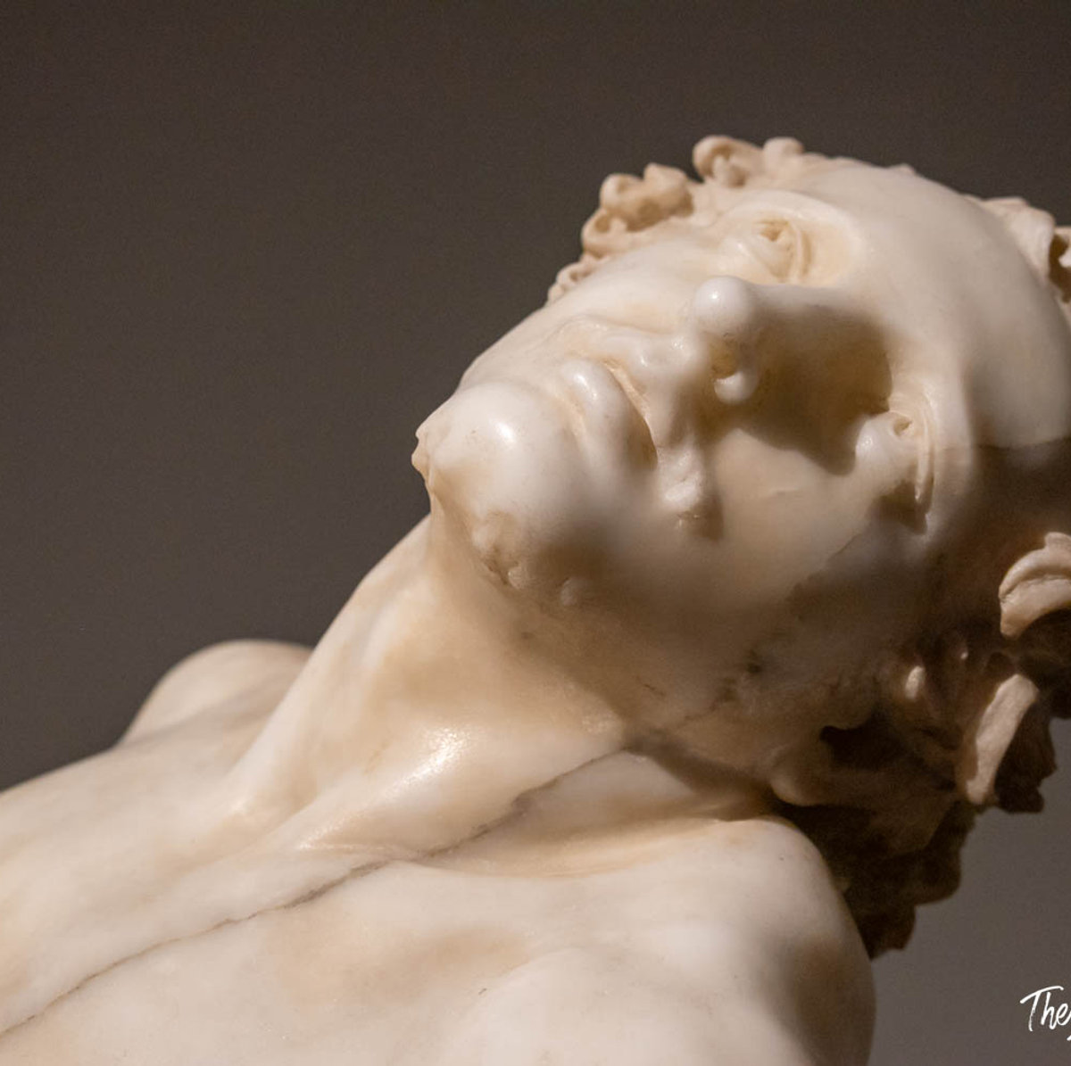 Close-up of a marble sculpture by Bernini, head tilted back with anguished expression, at Palazzo Barberini