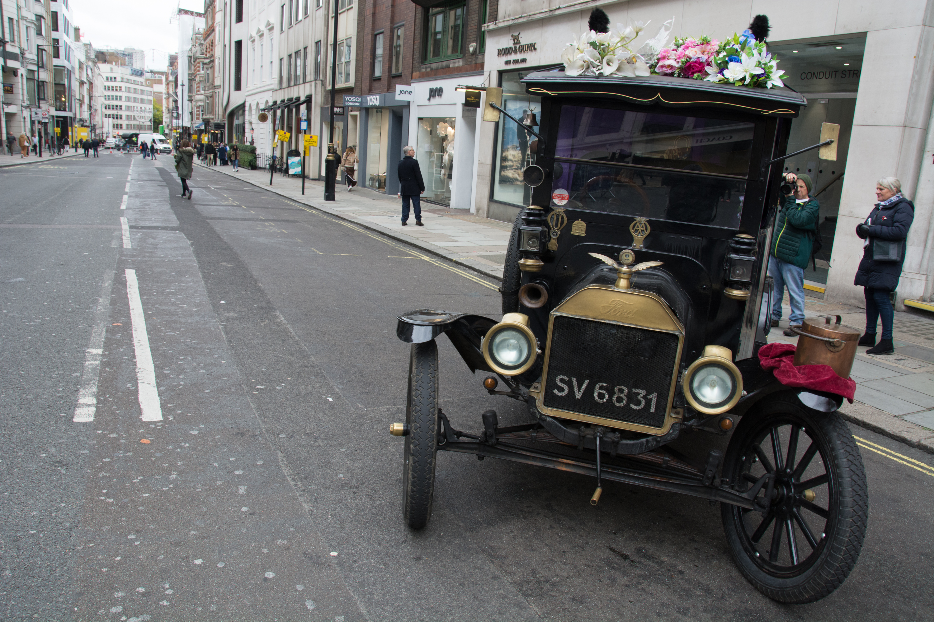 Vintage Ford Model T decorated with flowers parked on Conduit Street in London's West End