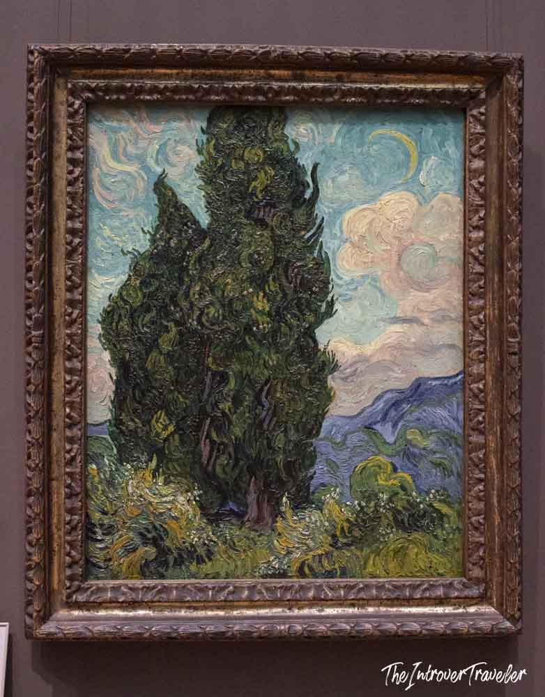 Cypresses by Vincent van Gogh, displayed in an ornate frame at the Metropolitan Museum of Art