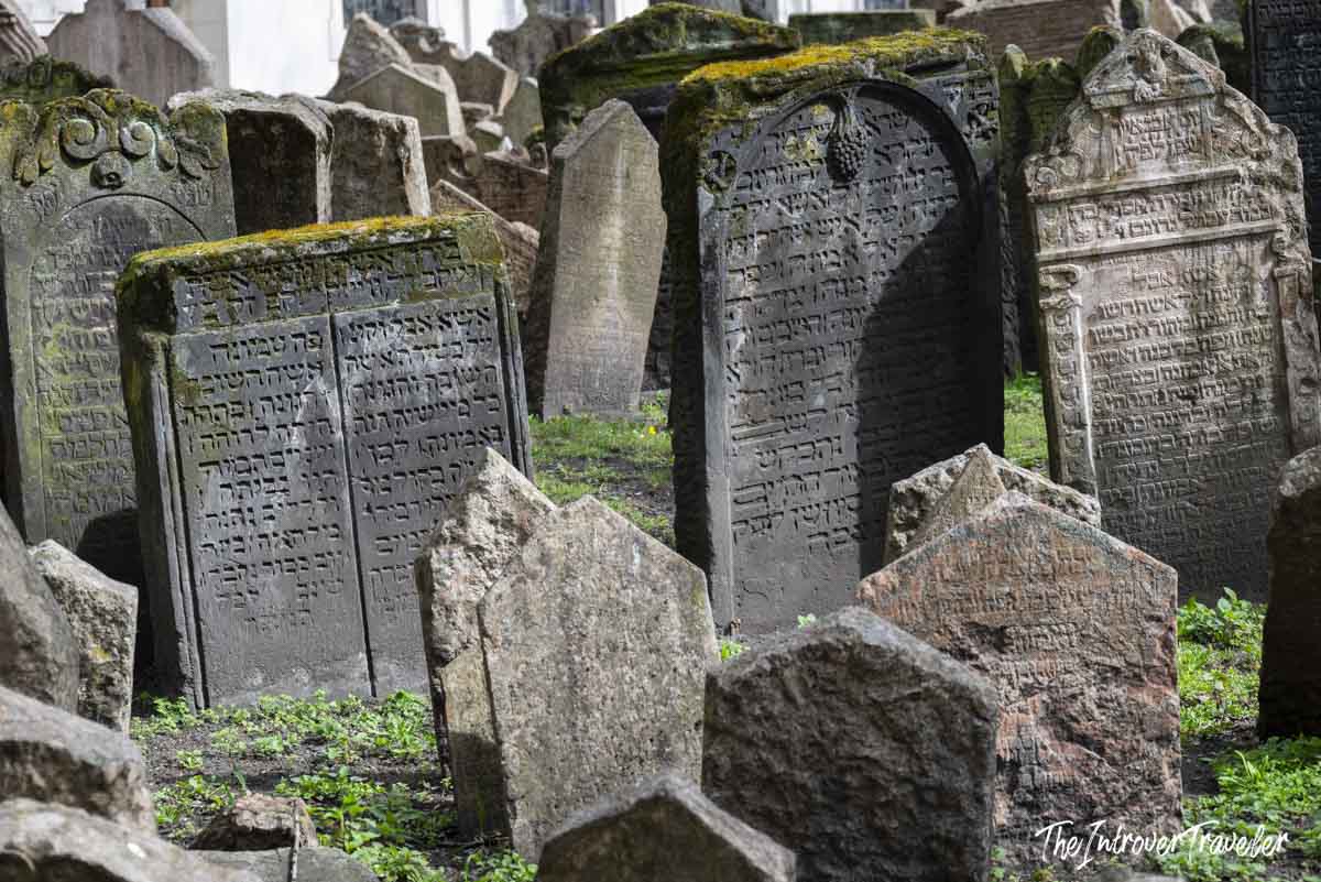 Densely packed Hebrew-inscribed gravestones at the Old Jewish Cemetery in Prague's Josefov quarter