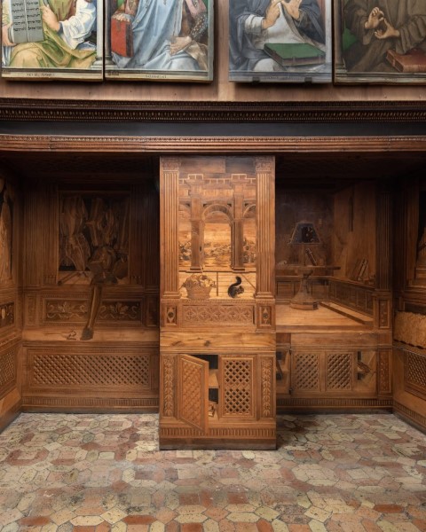 Intarsia wood panels in the Studiolo of Federico da Montefeltro, Urbino, showing trompe l'oeil shelves