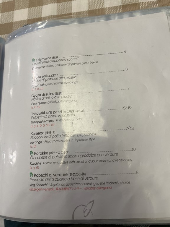 Japanese restaurant Yuzuya in Bologna, appetizers menu with gyoza, takoyaki, karaage, and korokke