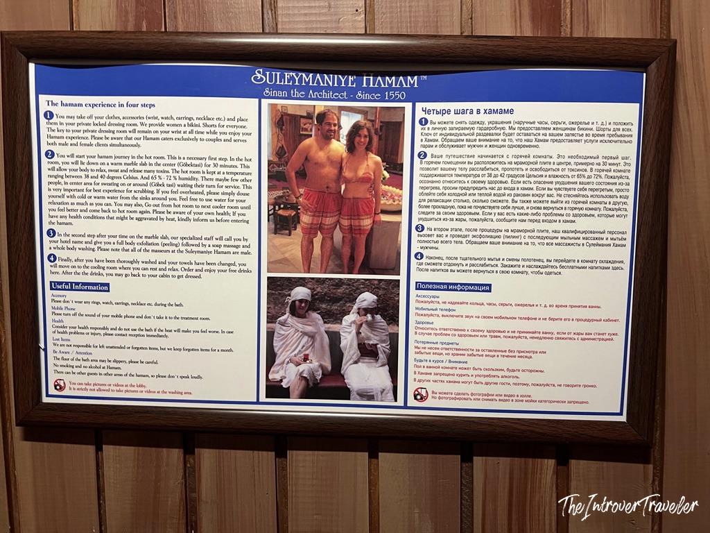 Süleymaniye Hamam information board in English and Russian, outlining the four steps of the bath experience since 1550