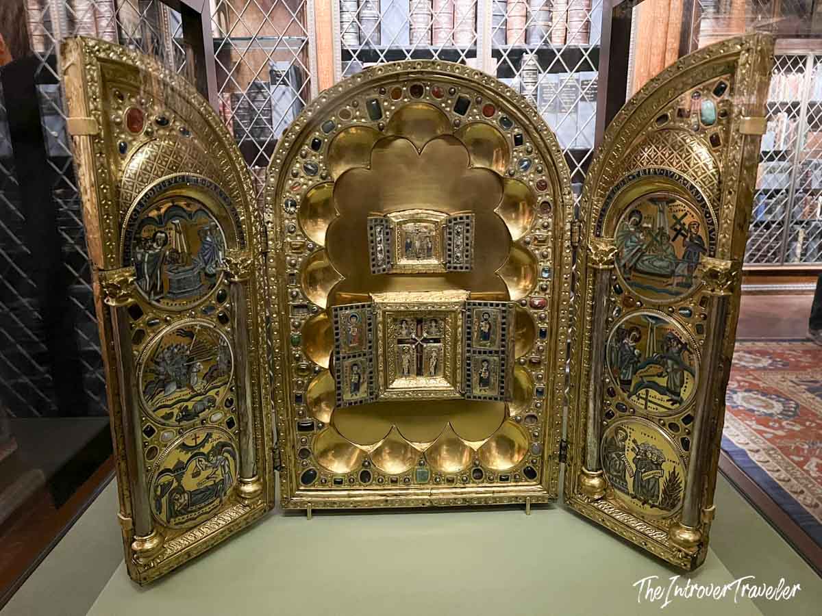 Gold and enamel medieval triptych reliquary with gemstone inlay on display at the Morgan Library Museum New York