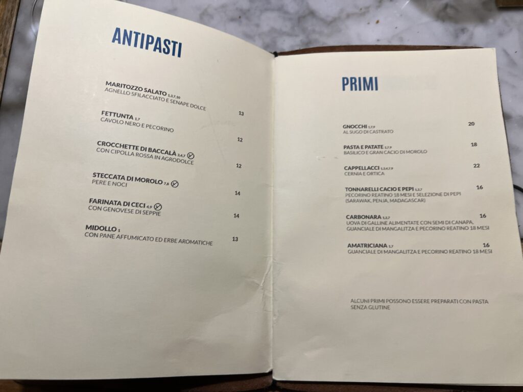 Italian restaurant menu showing antipasti and primi dishes at Osteria La Quercia, Rome