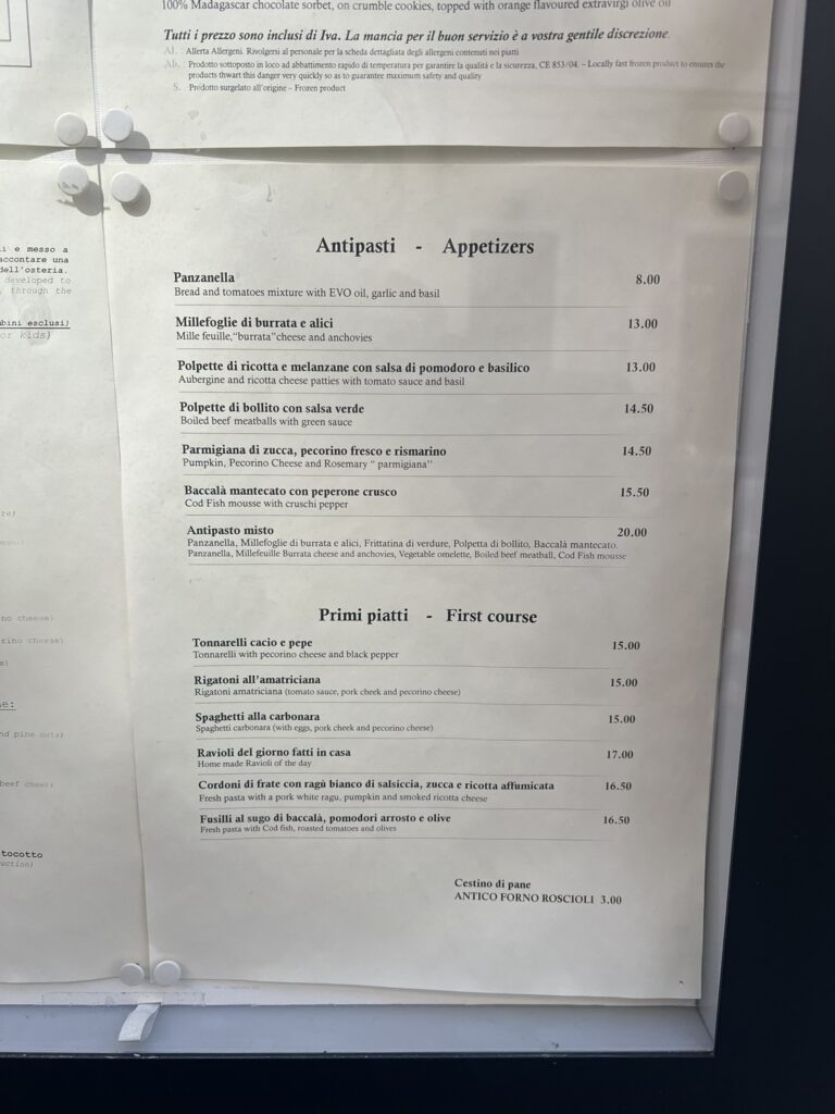 Italian menu at Hosteria Grappolo d'Oro, Rome, listing antipasti and pasta dishes with prices