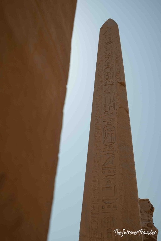 Tall obelisk covered in hieroglyphics at Karnak Temple Complex, Luxor Egypt
